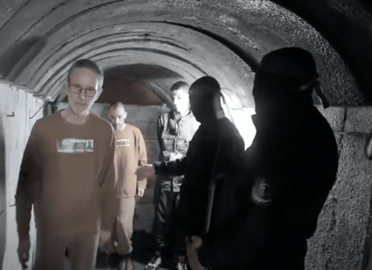 hostages Eli Sharabi, Ohad Ben Ami and Or Levy being led through a tunnel (Feb 2025,
