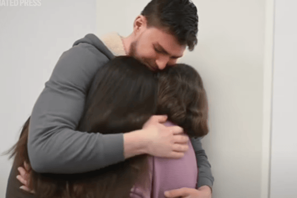 Freed hostage Alexandre “Sasha”Troufanov reunites with his mother and girlfriend Feb 2025 (YouTube screenshot)