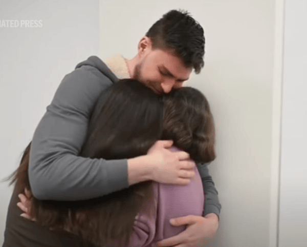 Freed hostage Alexandre “Sasha”Troufanov reunites with his mother and girlfriend Feb 2025 (YouTube screenshot)