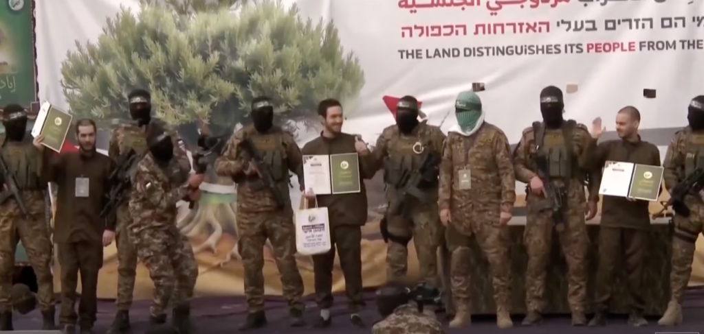 Hostages forced to participate in ceremony in Gaza. (YouTube screenshot)