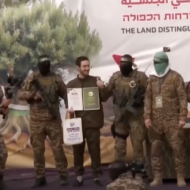 Hostages forced to participate in ceremony in Gaza. (YouTube screenshot)