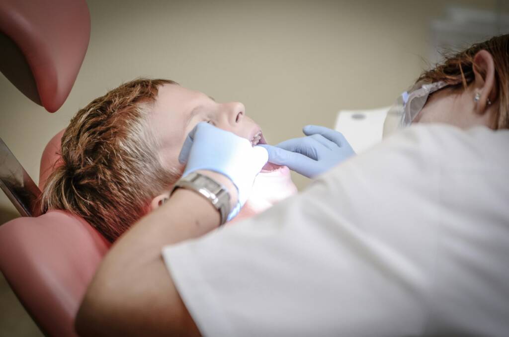 kid at dentist